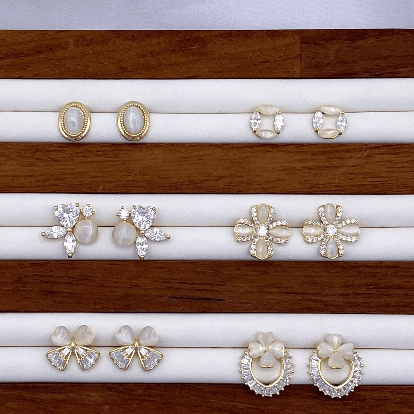 elliope, emeline, evalina, eisther, erich & erin earrings in gold